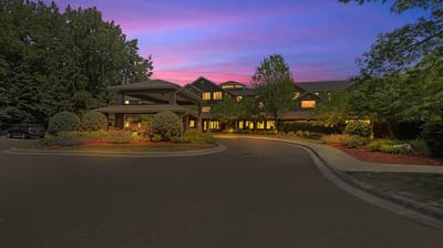 Exterior view of The Lodge at White Bear at dusk.