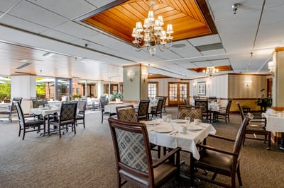 Elegant dining area with tables set for meals.