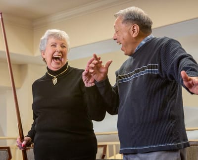Residents enjoying a fun moment in the community area.
