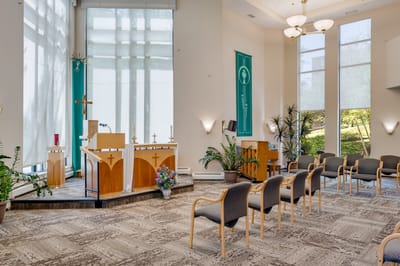 Interior view of a serene chapel space with seating