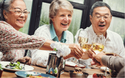 Residents celebrating with drinks and food.