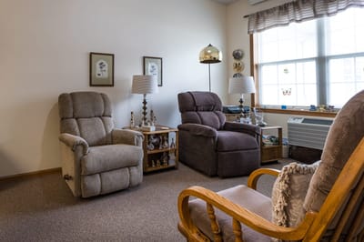 Comfortable chairs in a cozy room setting.