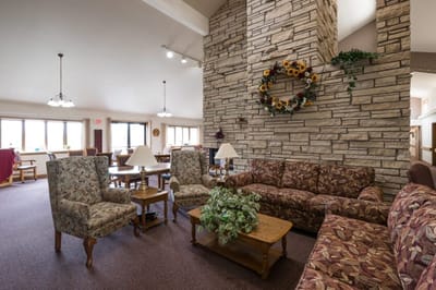 Cozy common area with couches and tables.