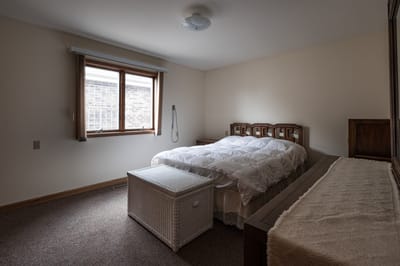Private resident room with a bed and window
