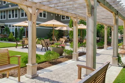 Outdoor patio area with seating and umbrellas.