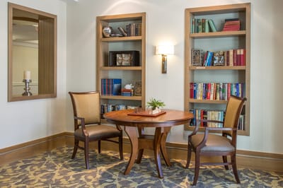 Cozy reading nook with bookshelves and a table
