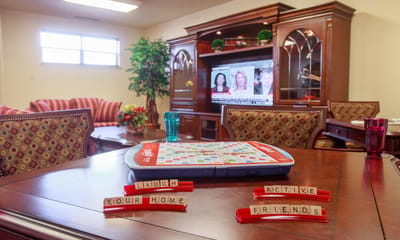Common area with a game and cheerful decor.