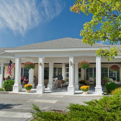 Exterior view of the facility with residents outside