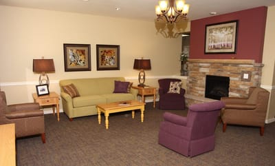 Cozy common area with seating and fireplace.