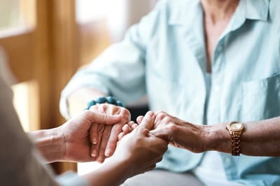 Close-up of hands during a gentle interaction