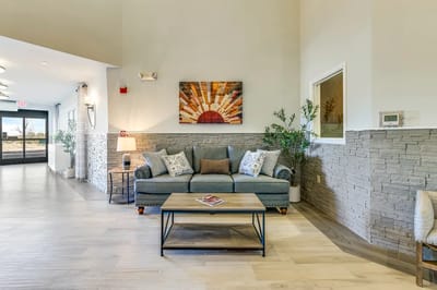 Comfortable common area with seating and artwork