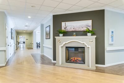 Interior common area with a fireplace and artwork