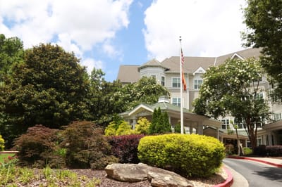 Exterior view of Sunrise at Buckhead with landscaped entrance