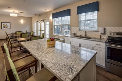 Modern common area with kitchenette and seating