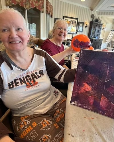 Residents enjoying a painting activity together.