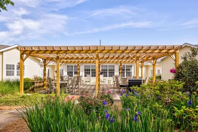 Outdoor patio area with seating and flowers