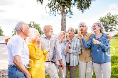 Residents enjoying bubble activity outdoors