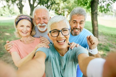 Group of smiling seniors enjoying the outdoors