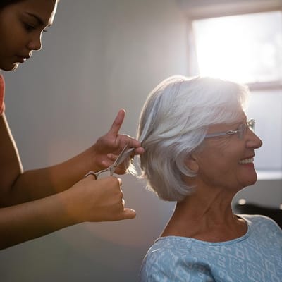 Senior woman getting her hair styled