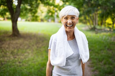 Active senior woman smiling outdoors