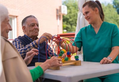 Residents engaging in a therapeutic activity outdoors.