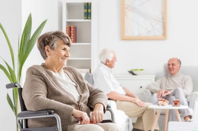 Residents engaging in conversation in a common area.