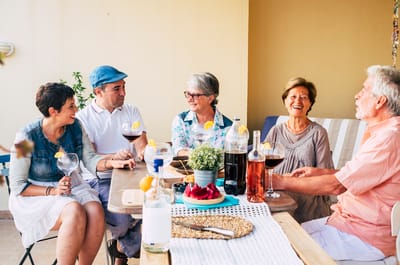 Group of people enjoying drinks outdoors