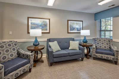 Comfortable lounge area with chairs and lamps.