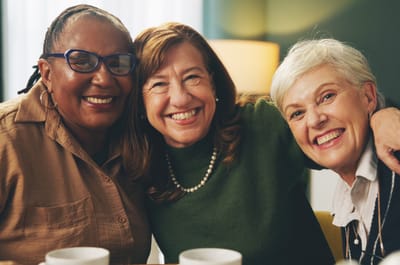 Three smiling women enjoying time together