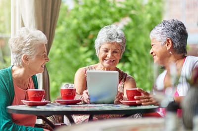 Three seniors enjoying time together outdoors
