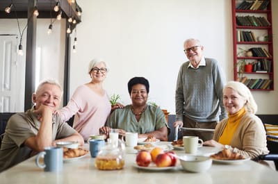 Group of residents enjoying breakfast together.
