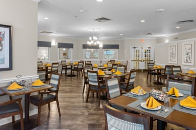 Dining room with tables set for meals.