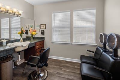 Hair salon interior with chairs and windows
