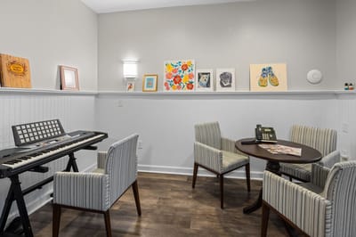 Cozy common area with seating and artwork.