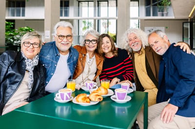 Seniors enjoying breakfast together in a common area