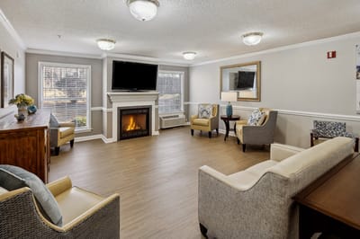 Cozy lounge area with seating and fireplace