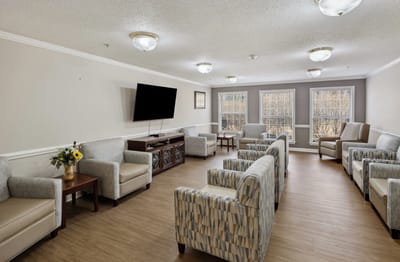 Common area with seating and windows.