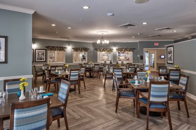 Dining room with tables set for meals.