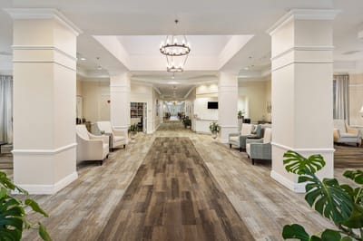 Bright corridor with seating and plants