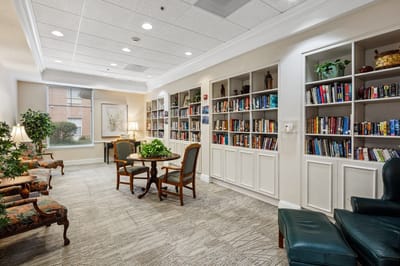 Cozy reading area with bookshelves and seating.