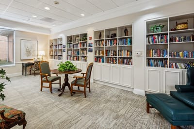 Cozy common area with bookshelves and seating