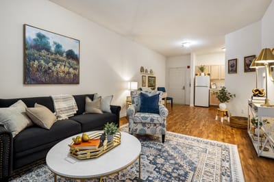 Cozy common area with comfortable seating and artwork.