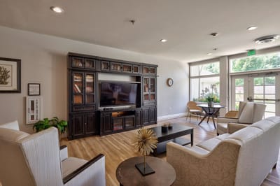 Common area with seating and television.