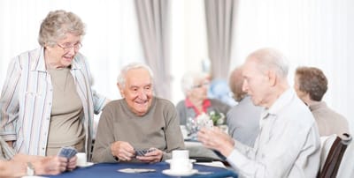 Residents engaging in a card game activity.