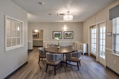 A common area with a round table and chairs.