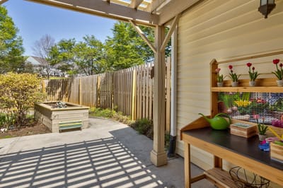 Garden area with planters and a potting table.