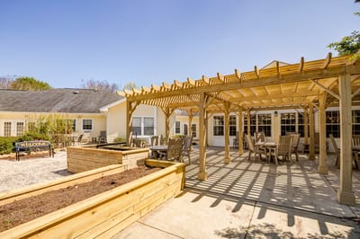 Outdoor seating area with pergola and planters