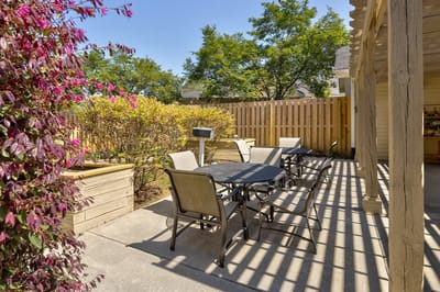 Outdoor seating area with tables and plants