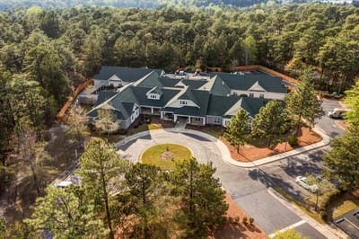 Aerial view of TerraBella Northridge surrounded by trees.