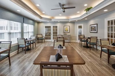 Bright dining area with tables and chairs